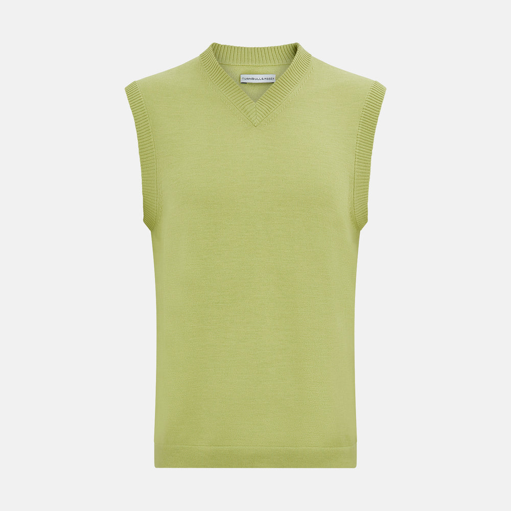 The Turnbull & Asser Melon Green Fine Merino V-Neck Vest, sleeveless with ribbed edges, is shown on a white background—ideal for layering or wearing alone as an elegant gentleman's piece.