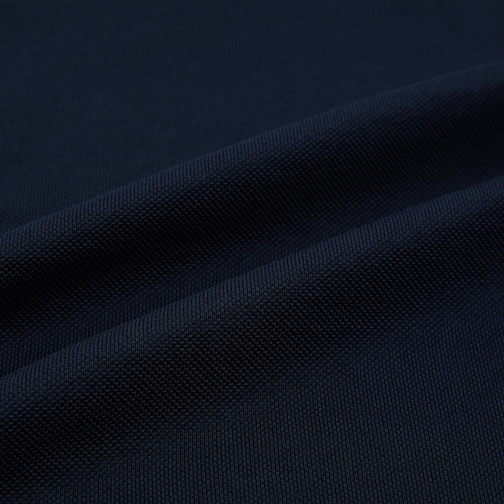 A Navy Rugby Polo Shirt by Turnbull & Asser, featuring long sleeves and a collar, is displayed flat on a white background. The design is simple and free of visible logos or patterns.