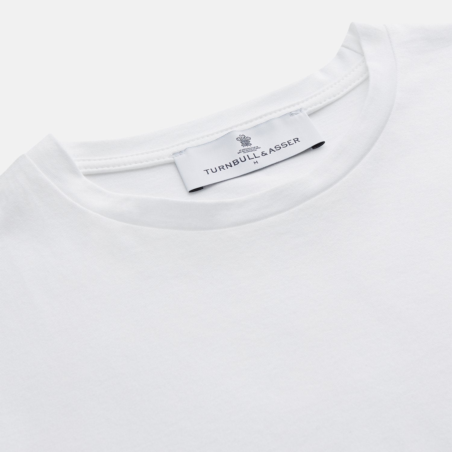 View 2 of product The White Davey Cotton T-Shirt by Turnbull & Asser is a plain white, fine-gauge jersey crew neck with short sleeves and a small neck tag, made in the UK and shown on a white background with no logos or designs.