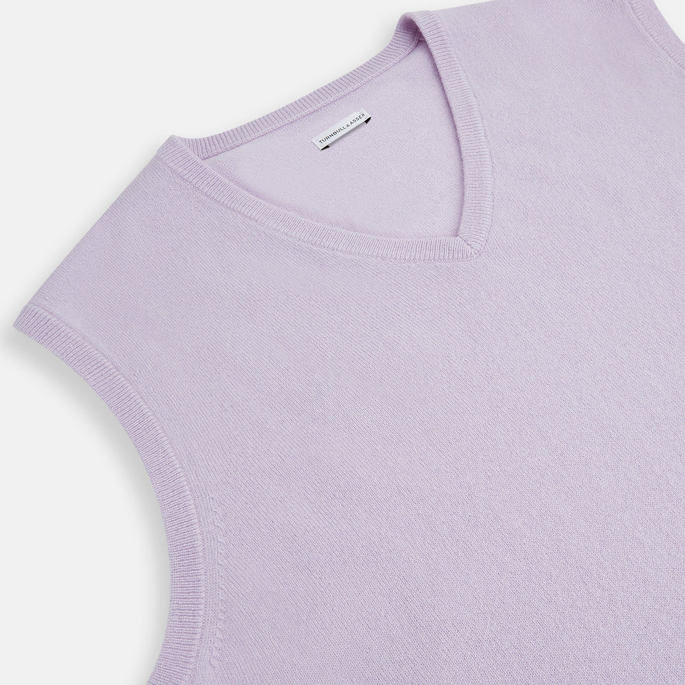 The Turnbull & Asser Lilac Cashmere V-Neck Vest is a sleeveless knit with a ribbed hem, showcasing sophisticated style in light purple against a plain white background.