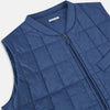 View 2 of product The Azzurro Quilted Gilet by Turnbull & Asser is a sleeveless, lightweight men’s outerwear piece featuring a front zipper, angled zippered pockets, and a chest pocket, shown against a plain white background.