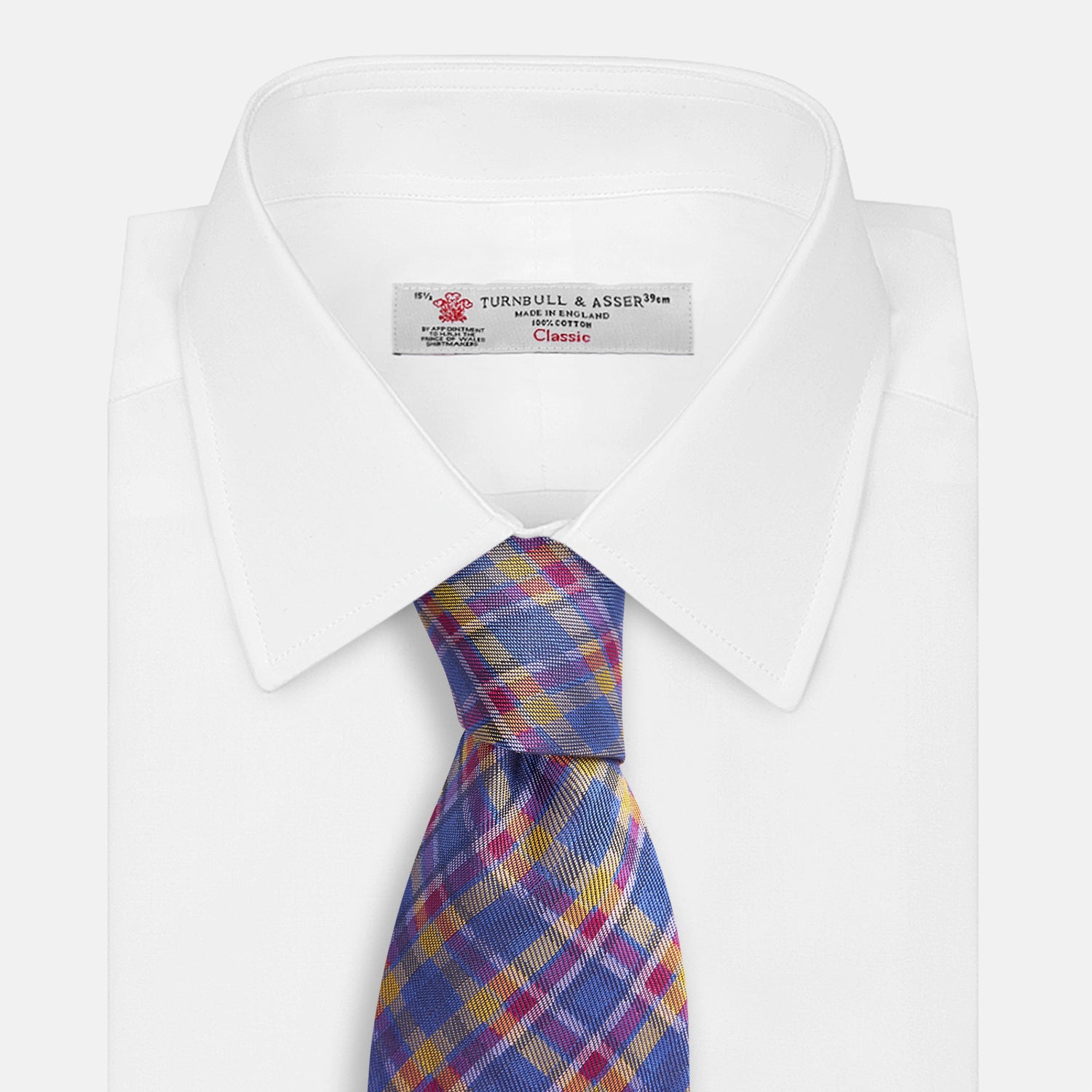 View 4 of product The Turnbull & Asser Blue Multi Tartan Silk Tie features a vibrant blue, yellow, and pink plaid pattern and is shown rolled up on a white background.