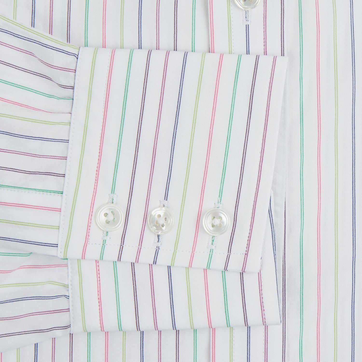 View 11 of product The Turnbull & Asser Multicoloured Double Pinstripe Mayfair Shirt, made from organic cotton, features thin blue, green, and pink stripes on white and is displayed laid flat on a white surface.