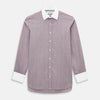 View 1 of product The Turnbull & Asser Light Porto Red Track Stripe Shirt features a Mayfair fit and contrast white T&A collar and cuffs, with vertical blue stripes on mauve, exemplifying British craftsmanship.