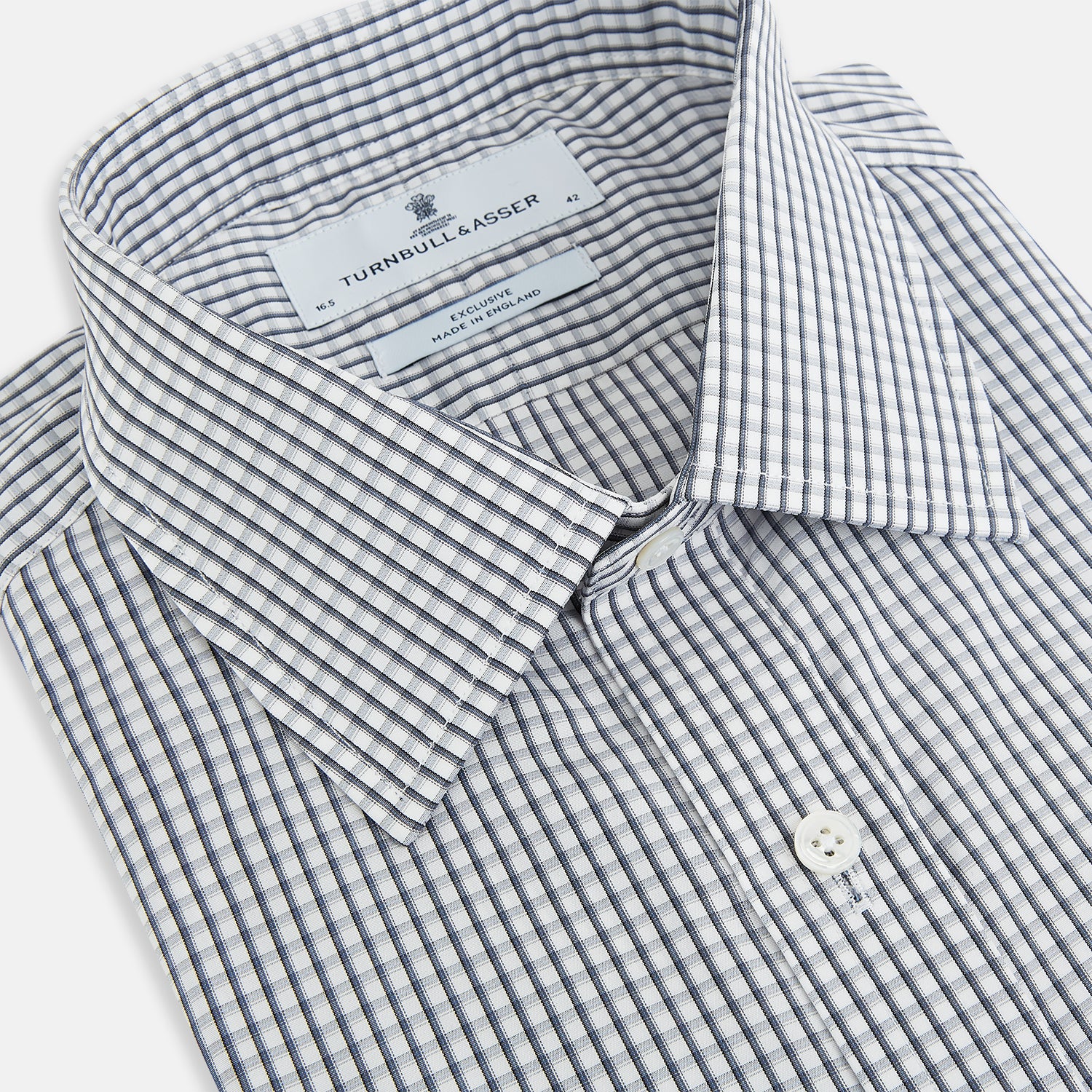 View 2 of product The Grey Double Graph Mayfair Shirt by Turnbull & Asser is a long-sleeve, button-down cotton shirt with a black and white double graph check, chest pocket, and classic collar.