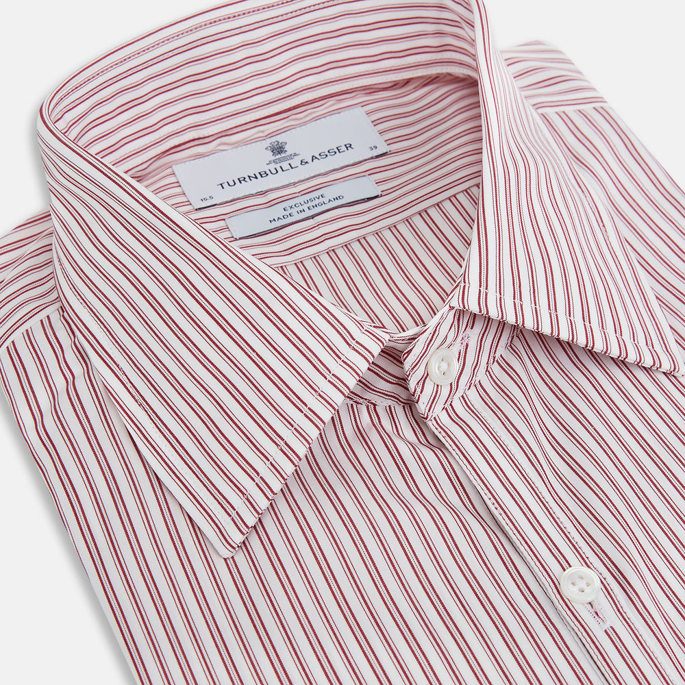 The Red Ticking Stripe Westminster Shirt by Turnbull & Asser features long sleeves, a button-up front, and vertical red and white stripes, shown flat on a white background.