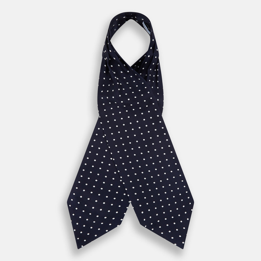 The White Dot and Navy Silk Cravat by Turnbull & Asser features evenly spaced white polka dots on navy silk—a classic accessory ideal for adding British elegance to any look.