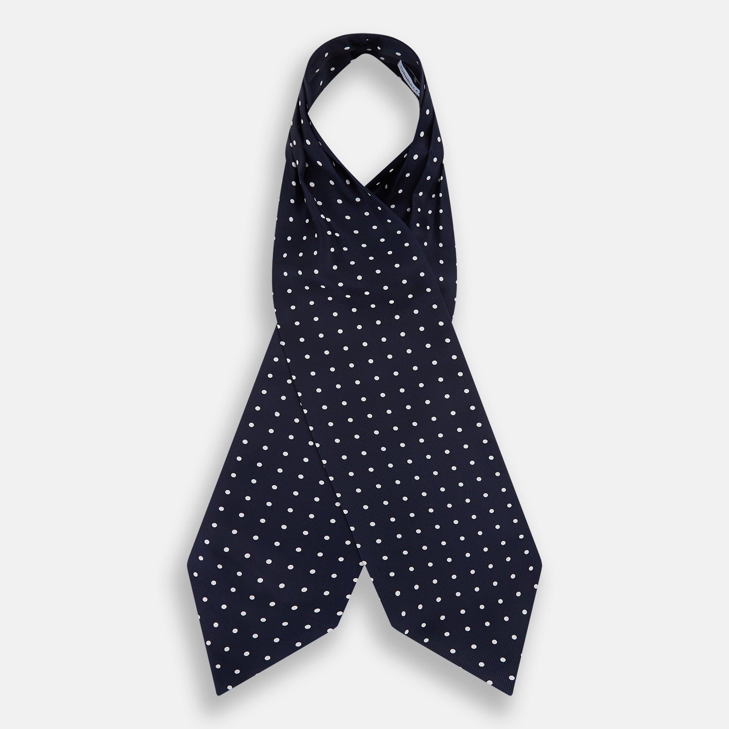 View 2 of product The White Dot and Navy Silk Cravat by Turnbull & Asser features evenly spaced white polka dots on navy silk—a classic accessory ideal for adding British elegance to any look.