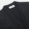 View 2 of product The Turnbull & Asser Charcoal Lachlan Cashmere Cardigan features long sleeves, a V-neck, button-down front, two pockets, and ribbed cuffs—ideal for smart-casual layering—shown laid flat on a white background.