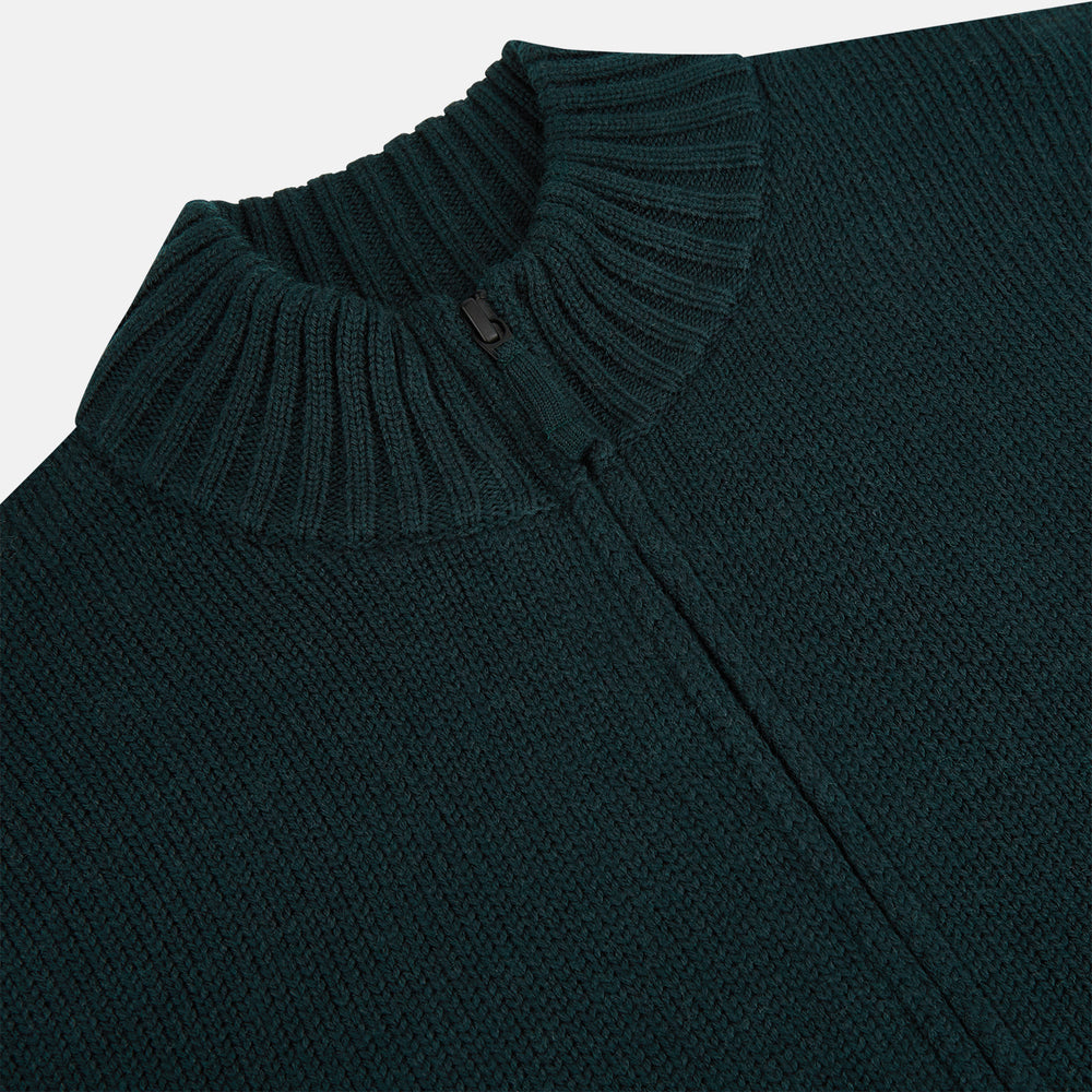 The Turnbull & Asser Forest Green Merino High Neck Zipped Cardigan features long sleeves, a ribbed high neck, cuffs, and hem, shown against a plain white background.