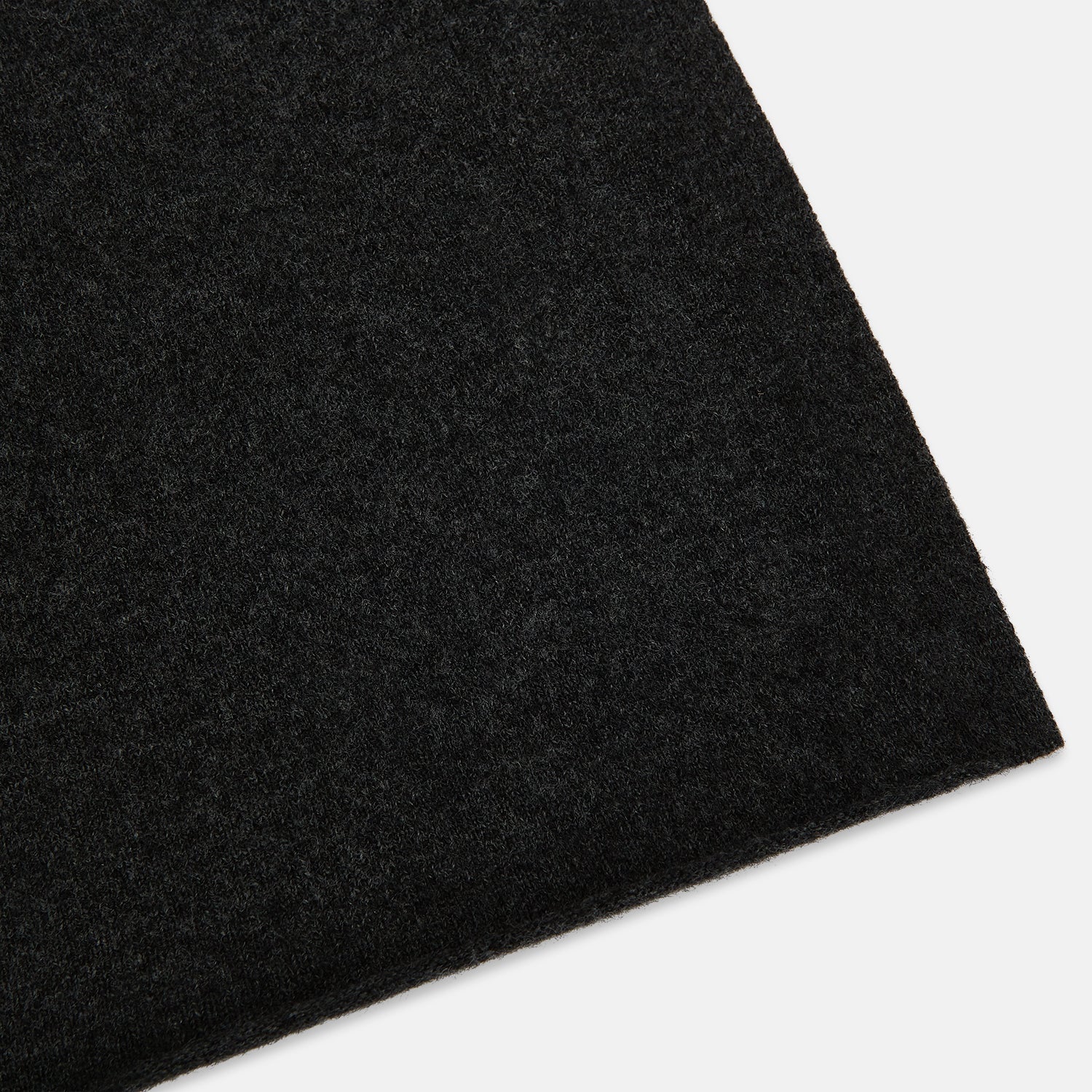 View 2 of product The Turnbull & Asser Plain Charcoal Cashmere Knitted Scarf, shown tied simply against a white background, is a classic luxury accessory perfect for any wardrobe.
