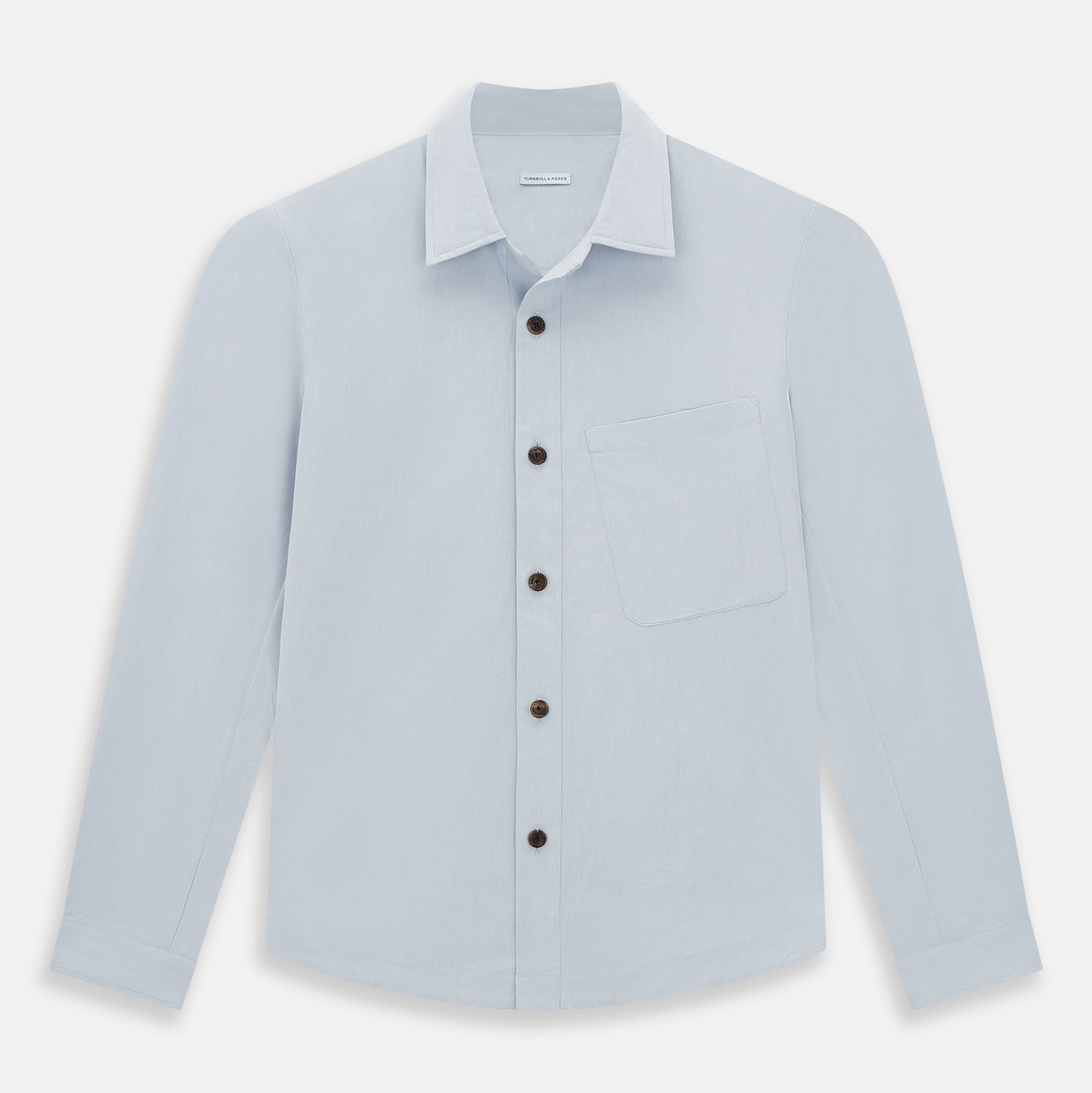 View 1 of product The Turnbull & Asser Grey Hyde Overshirt is a long-sleeve button-up made from sanforised cotton, featuring a single chest pocket and dark buttons, shown against a plain white background.