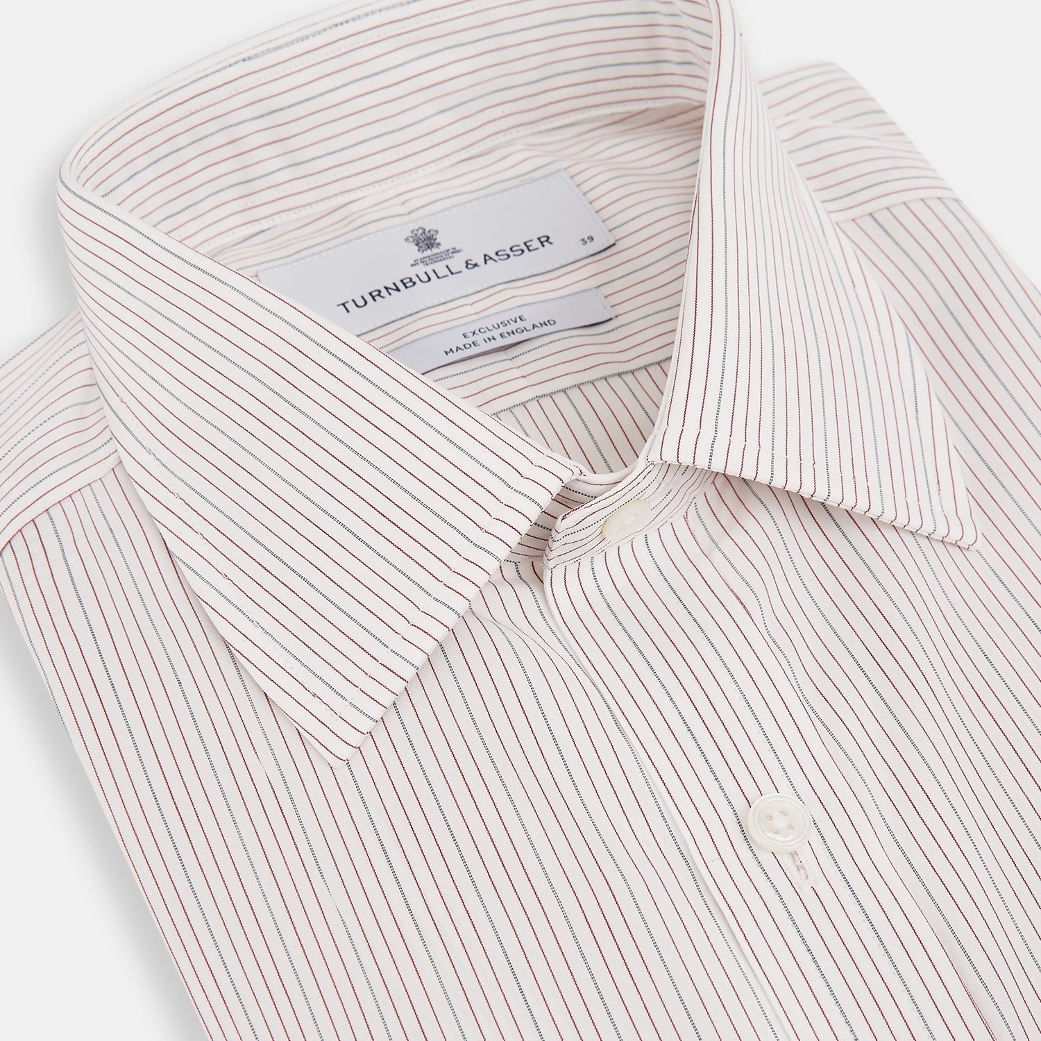 View 2 of product The Turnbull & Asser Burgundy Multi Hairline Stripe Mayfair Shirt features long sleeves, a classic collar, buttoned cuffs, and slim vertical stripes—ideal for formal wear and shown against a plain white background.