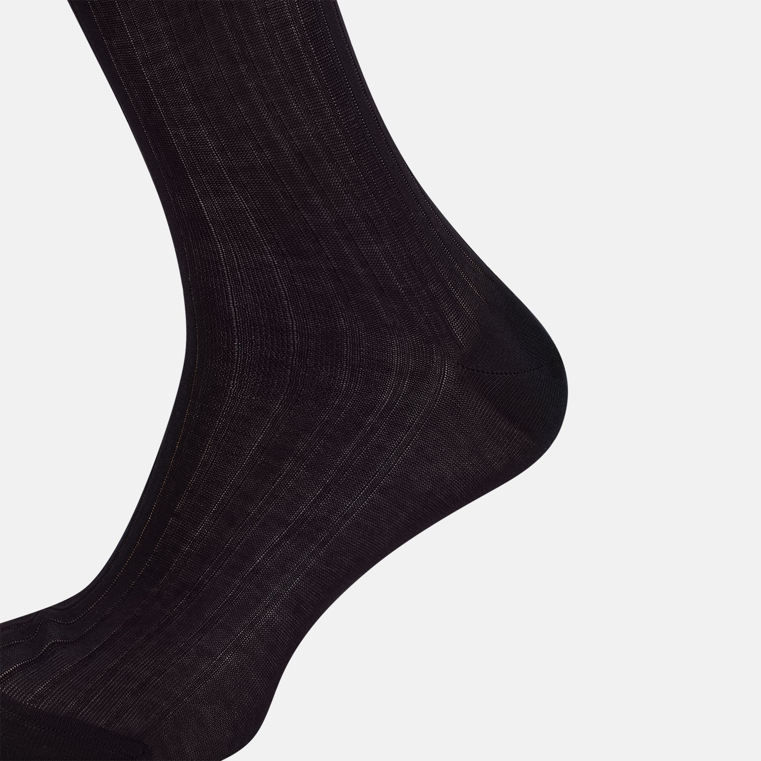 View 4 of product A single Midnight Blue Long Sock by Turnbull & Asser is shown on a white background, showcasing a ribbed texture and a fitted design that extends from the foot to the top of the calf.