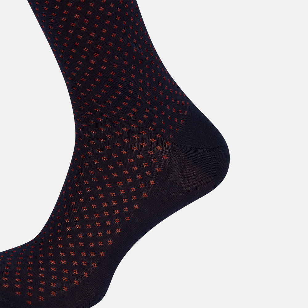 A single Navy/Red Motif Mid-Length Sock by Turnbull & Asser, displayed upright on a white background. The sock features a calf-length style, ribbed cuff, hand-linked toe for comfort, and a subtle red pattern.