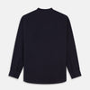 View 5 of product The Turnbull & Asser Navy Military Weekend Fit Shirt features a stand collar, black buttons, dual chest flap pockets, and 1-button cuffs in Italian cotton-wool, shown laid flat on a white background.