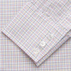 View 5 of product A man stands against a beige background, facing forward with a neutral expression and arms relaxed, wearing the Turnbull & Asser Red Multi Check Regular Fit Mayfair Shirt.
