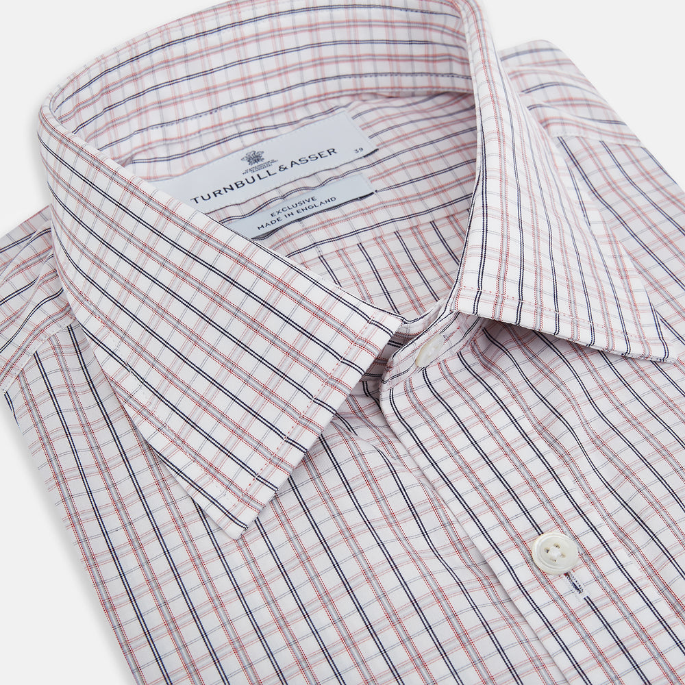The Turnbull & Asser Red and Blue Multi Check Mayfair Shirt is a long-sleeve button-down made from Italian cotton with a white base and a light red and blue check pattern, shown laid flat on a white background.