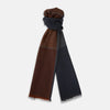 View 1 of product The Turnbull & Asser Brown and Navy Cashmere Scarf features a long, rectangular shape, color block design, soft texture, and lightly frayed edges, elegantly folded on a plain white background.