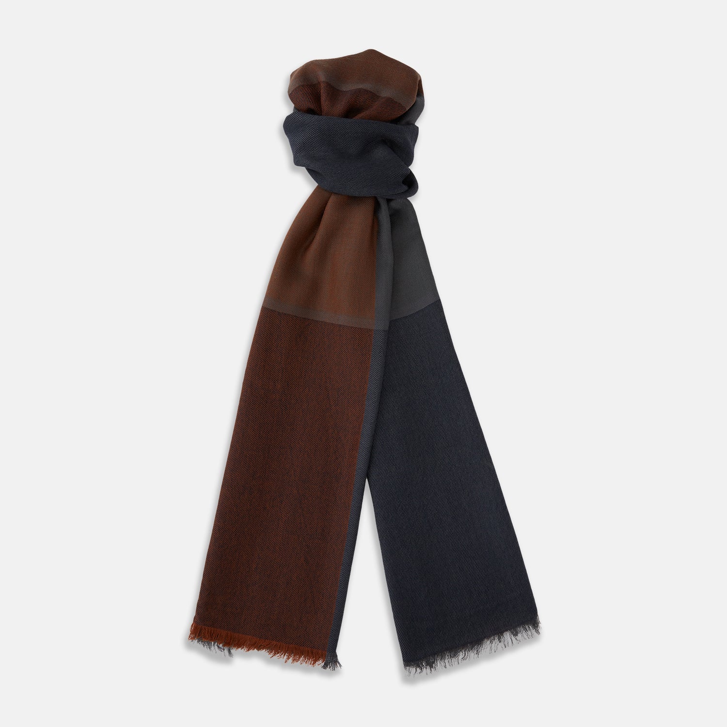 View 1 of product The Turnbull & Asser Brown and Navy Cashmere Scarf features a long, rectangular shape, color block design, soft texture, and lightly frayed edges, elegantly folded on a plain white background.