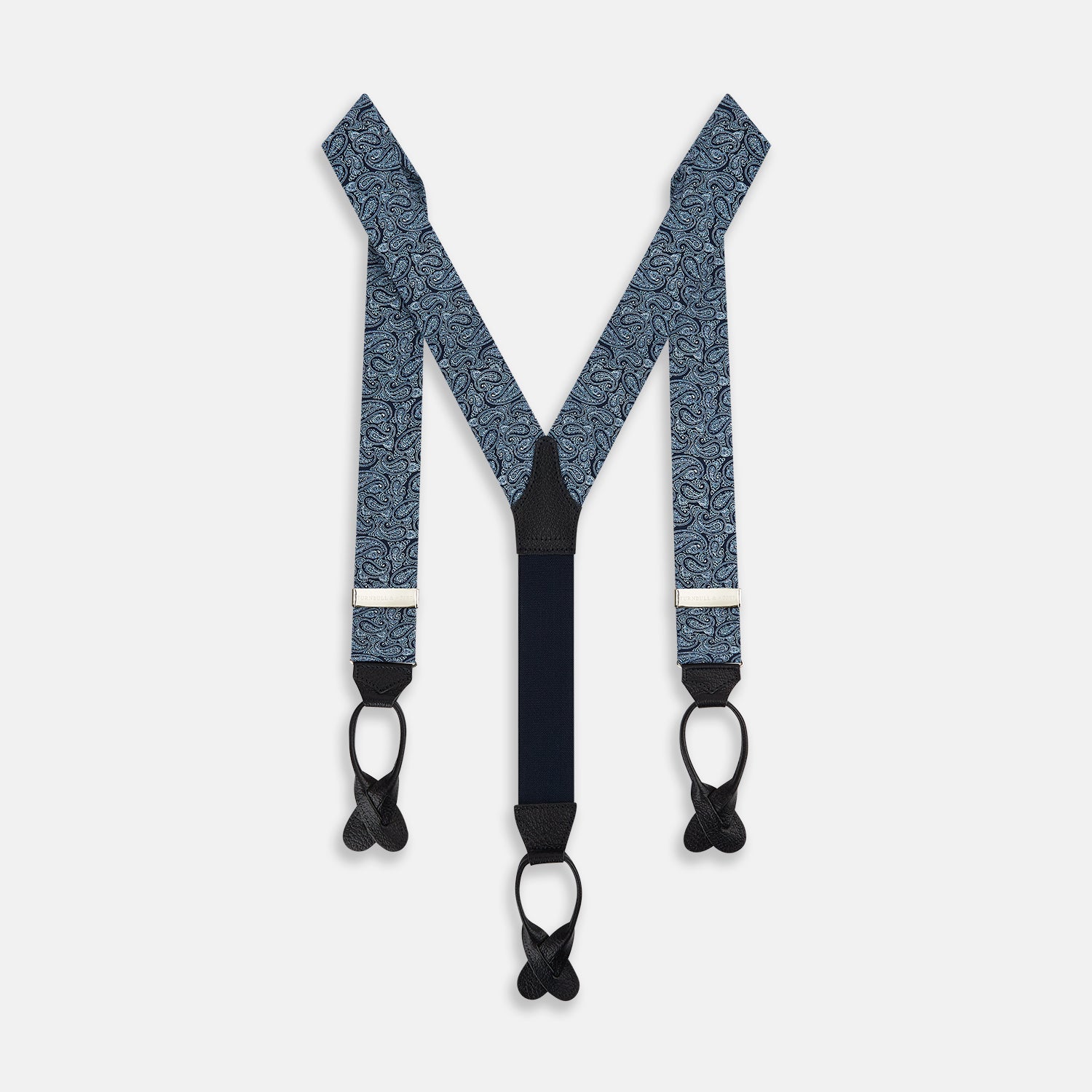 View 1 of product Turnbull & Asser Dark Navy Paisley Adjustable Silk and Navy Leather Braces with silver adjusters, arranged in an M shape on a plain white background—ideal for refined sartorial styling.