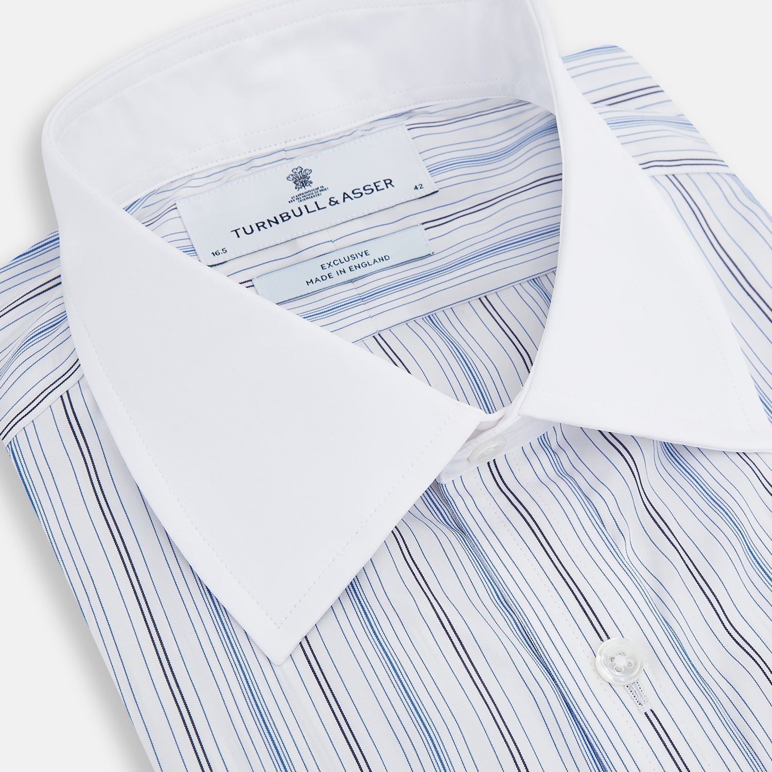 View 2 of product The Turnbull & Asser Navy and Blue Multi Stripe Shirt with Contrast Collar and Double Cuffs is shown in a Mayfair fit on a plain white background.