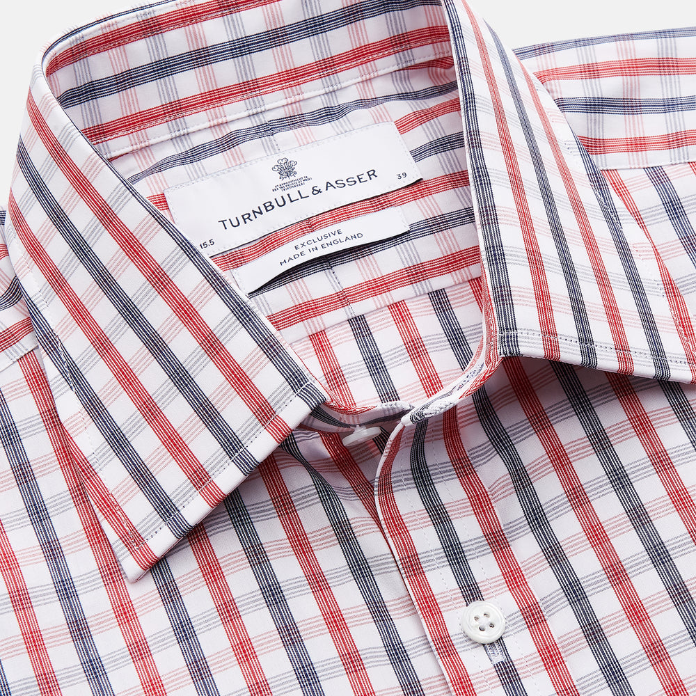 The Turnbull & Asser Navy and Red Check Cotton Regular Fit Mayfair Shirt features a classic T&A collar and long sleeves, shown laid flat on a white background.