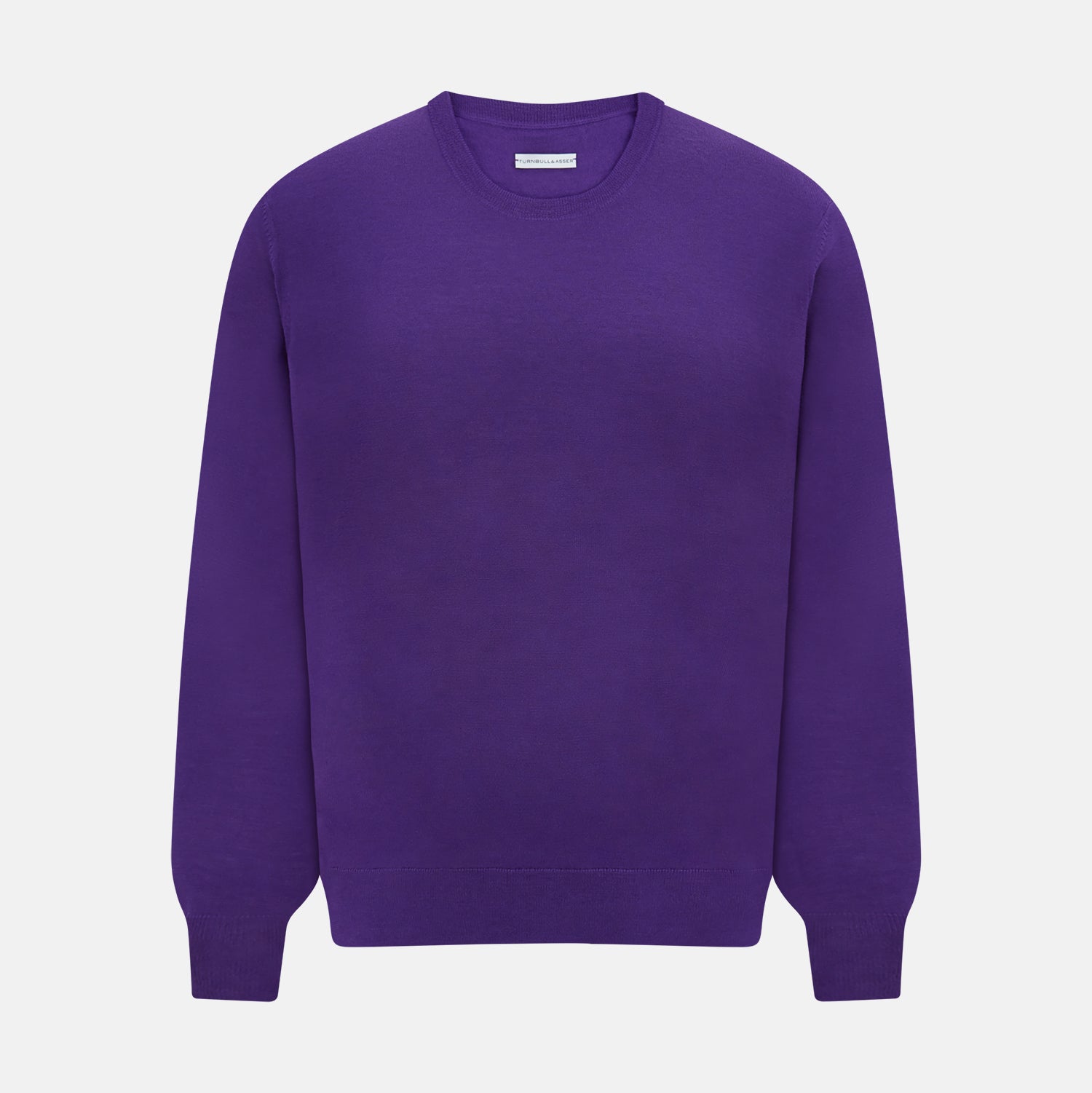 View 1 of product The Turnbull & Asser Purple Merino Round Neck Jumper, a classic men’s knitwear piece, is shown against a white background.