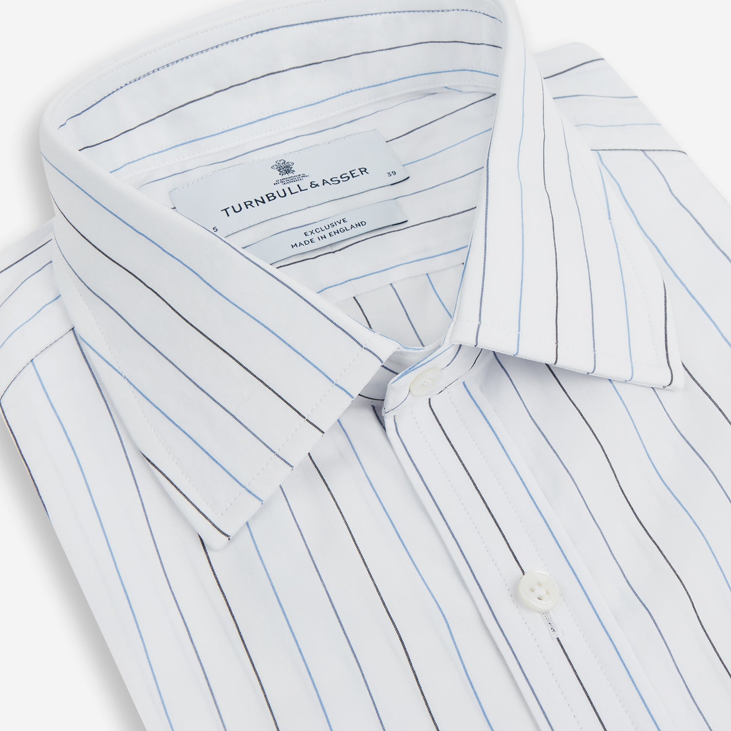 View 2 of product The Blue Wide Pinstripe Mayfair Shirt by Turnbull & Asser is a contemporary long-sleeve button-down with a collar, crafted from white fabric with bold vertical blue pinstripes. It is displayed neatly on a plain white background.