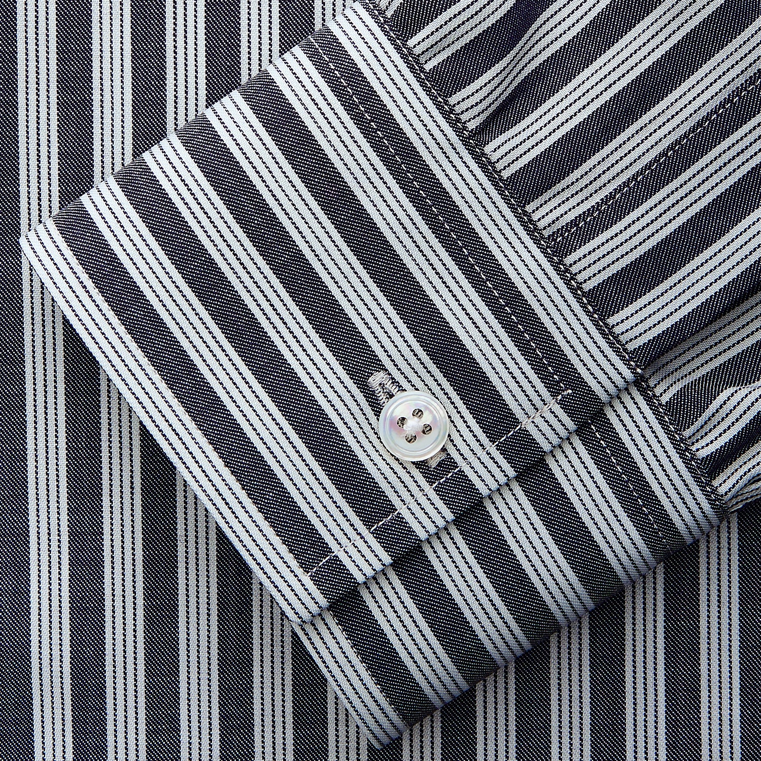 View 3 of product The Turnbull & Asser Navy Multi Stripe Weekend Fit Wool Shirt features a Derby collar, 1 button cuffs, and bold multicolored stripes, shown laid flat on a plain background.
