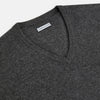 View 2 of product The Charcoal Grey Cashmere V-neck Jumper by Turnbull & Asser features ribbed cuffs, hem, and neckline—an essential knitwear piece, shown on a white background.