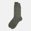 View 2 of product The Forest Green Linen Mid-Length Sock by Turnbull & Asser features a ribbed texture and is shown upright on a plain white background. Made from breathable linen, it offers comfort and style for everyday wear.