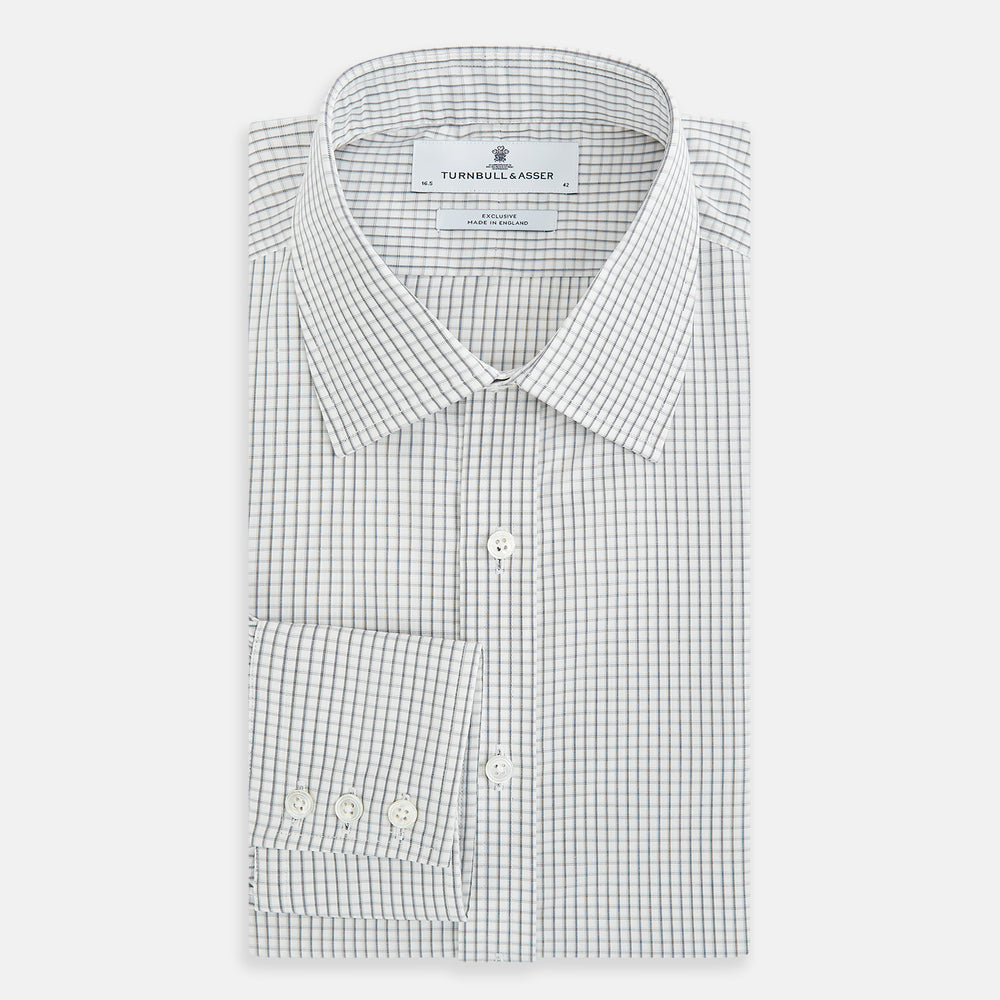 The Midnight Blue Multi Check Mayfair Shirt by Turnbull & Asser is a pure cotton, long-sleeve button-down featuring a small blue multi-check pattern, pointed collar, and buttoned cuffs.