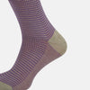 View 4 of product The Turnbull & Asser Concrete Houndstooth Mid-Length Sock features a purple and black houndstooth pattern with beige cuff, heel, and toe, crafted from soft cotton and shown on a plain white background.