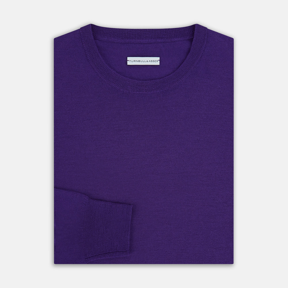 The Turnbull & Asser Purple Merino Round Neck Jumper, a classic men’s knitwear piece, is shown against a white background.