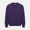 View 1 of product The Turnbull & Asser Purple Cashmere V-neck Jumper features long sleeves with ribbed cuffs and hem—a classic knitwear piece for effortless layering, shown against a white background.