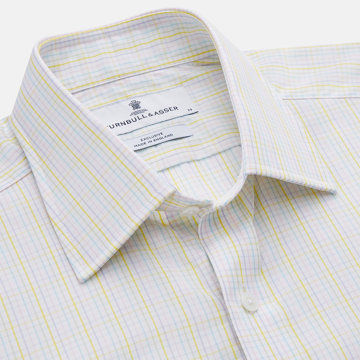 View 2 of product The Turnbull & Asser Yellow Multi Check Cotton Regular Fit Mayfair Shirt features a long-sleeved, button-up design with yellow and blue plaid, pointed collar, and buttoned cuffs, laid flat on a white background.