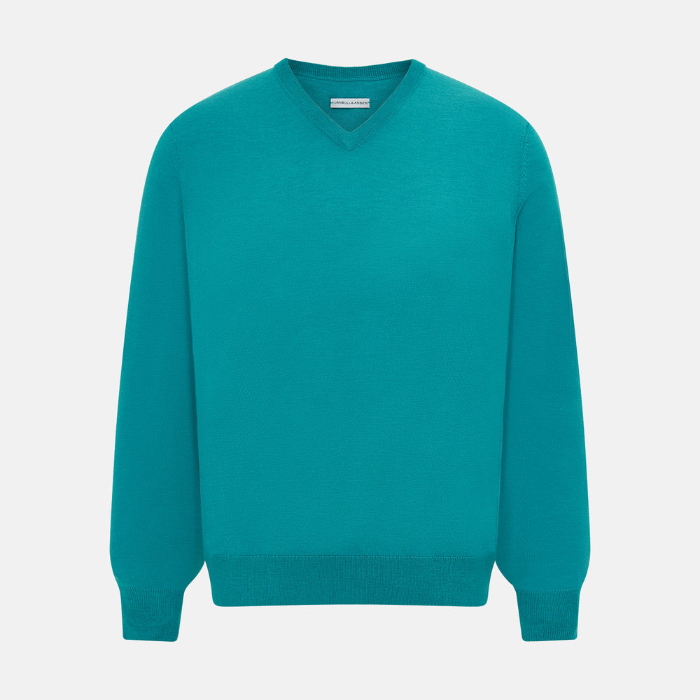 The Turnbull & Asser Turquoise Fine Merino V-Neck Jumper features long sleeves, ribbed cuffs and waistband, shown on a white background—a timeless choice for classic knitwear enthusiasts.