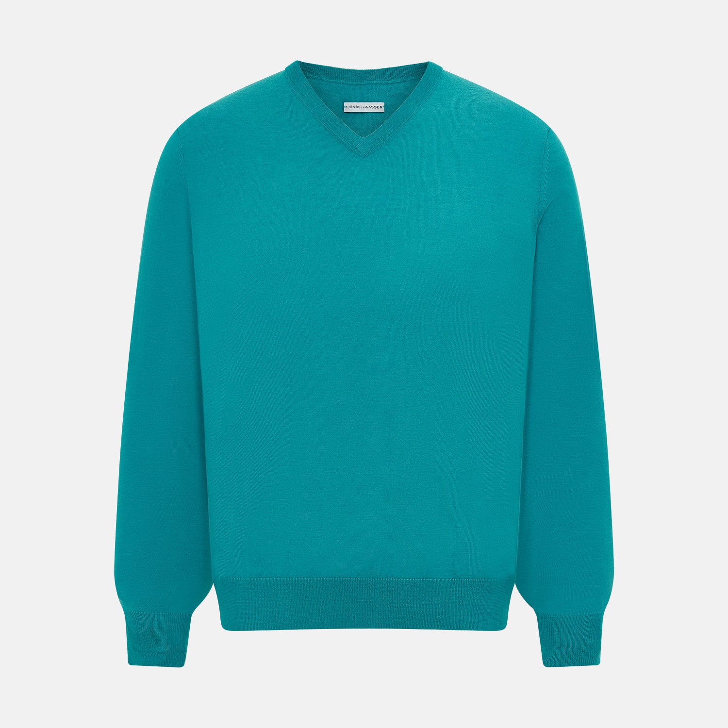View 1 of product The Turnbull & Asser Turquoise Fine Merino V-Neck Jumper features long sleeves, ribbed cuffs and waistband, shown on a white background—a timeless choice for classic knitwear enthusiasts.