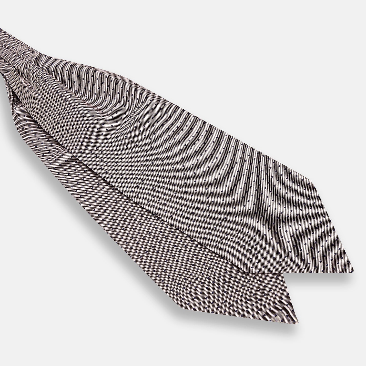 View 3 of product A folded, light-colored pocket square with small dark dots is displayed on a white background. Neatly arranged in a pointed fold, it pairs perfectly with the Turnbull & Asser Lilac and Navy Micro Dot Silk Cravat for an elegant look.
