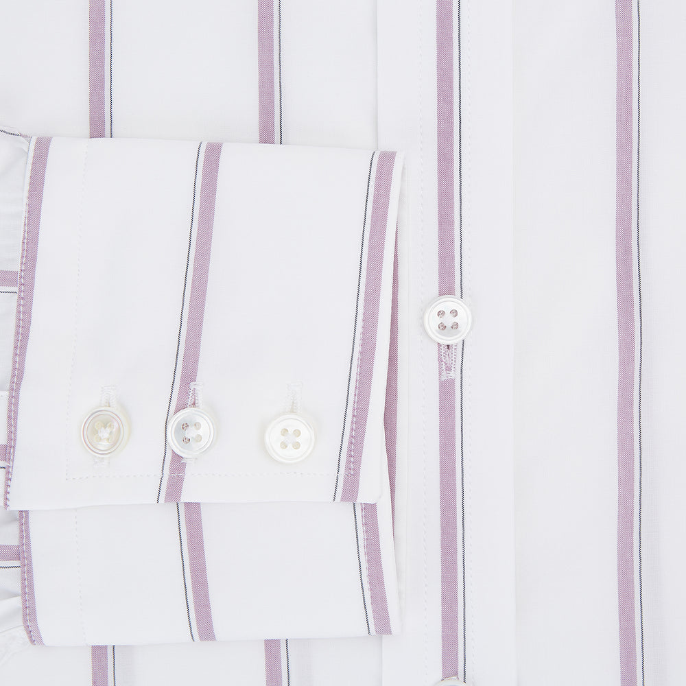 The Turnbull & Asser Antique Pink Track Stripe Mayfair Shirt is a white, long-sleeved Italian cotton shirt with vertical pink stripes, a spread collar, and buttoned cuffs, shown laid flat on a white background.