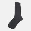 View 2 of product The Turnbull & Asser Steel Melange Mid-Length Sock, in dark gray ribbed mercerised Egyptian cotton, is shown upright on a white background to highlight its elegant shape and texture.