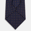 View 3 of product The Turnbull & Asser Navy and Brown Circle Silk Tie features an elegant pattern, perfect for adding a refined touch to your modern office attire.