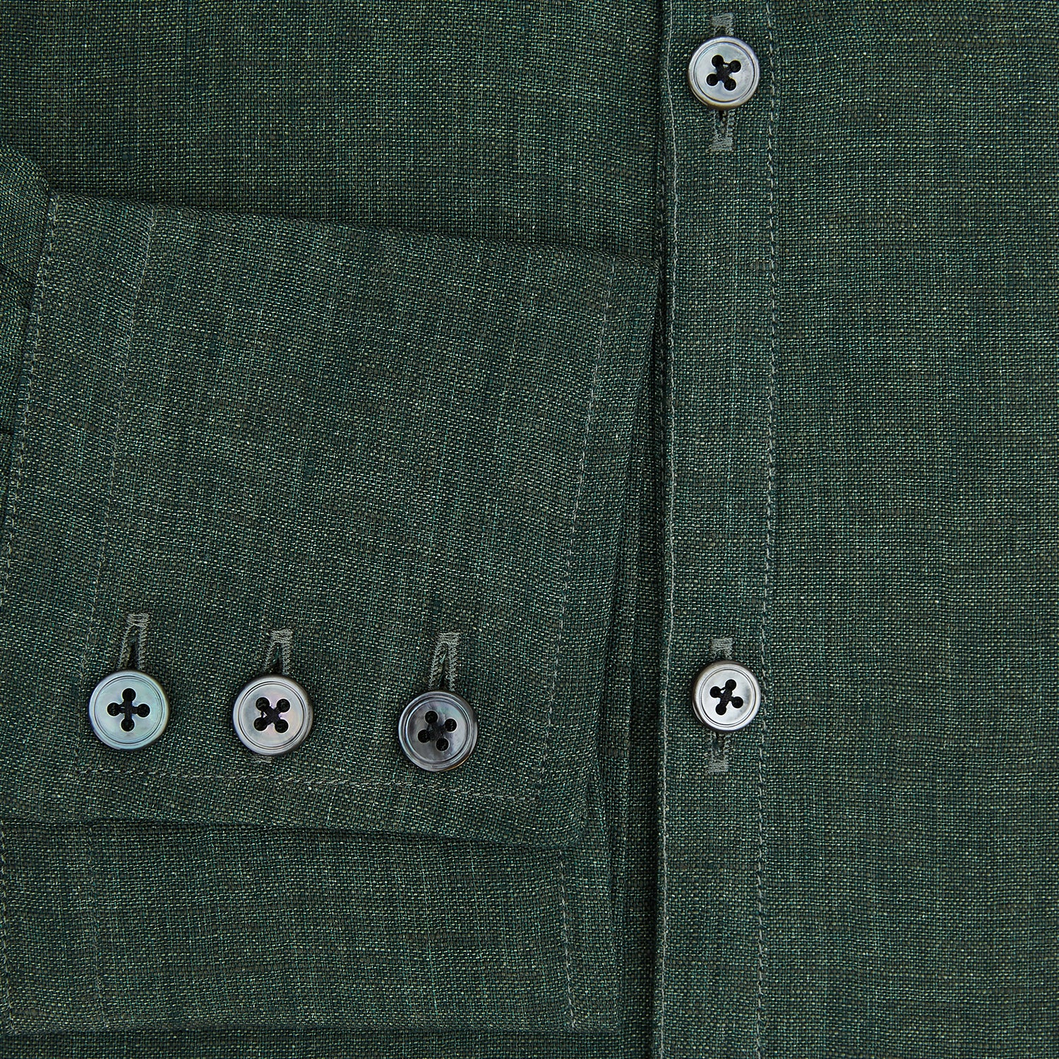 View 4 of product The Forest Green Linen Westminster Shirt by Turnbull & Asser features long sleeves, a Turnbull collar, and a button-up design, shown laid flat on a white background.