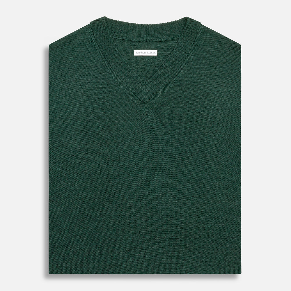 Turnbull & Asser's Petrol Green Fine Merino V-Neck Vest is shown from the front on a white background, highlighting its classic and simple sleeveless design.