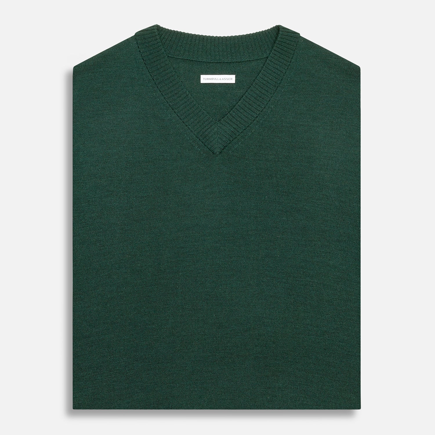 View 4 of product Turnbull & Asser's Petrol Green Fine Merino V-Neck Vest is shown from the front on a white background, highlighting its classic and simple sleeveless design.