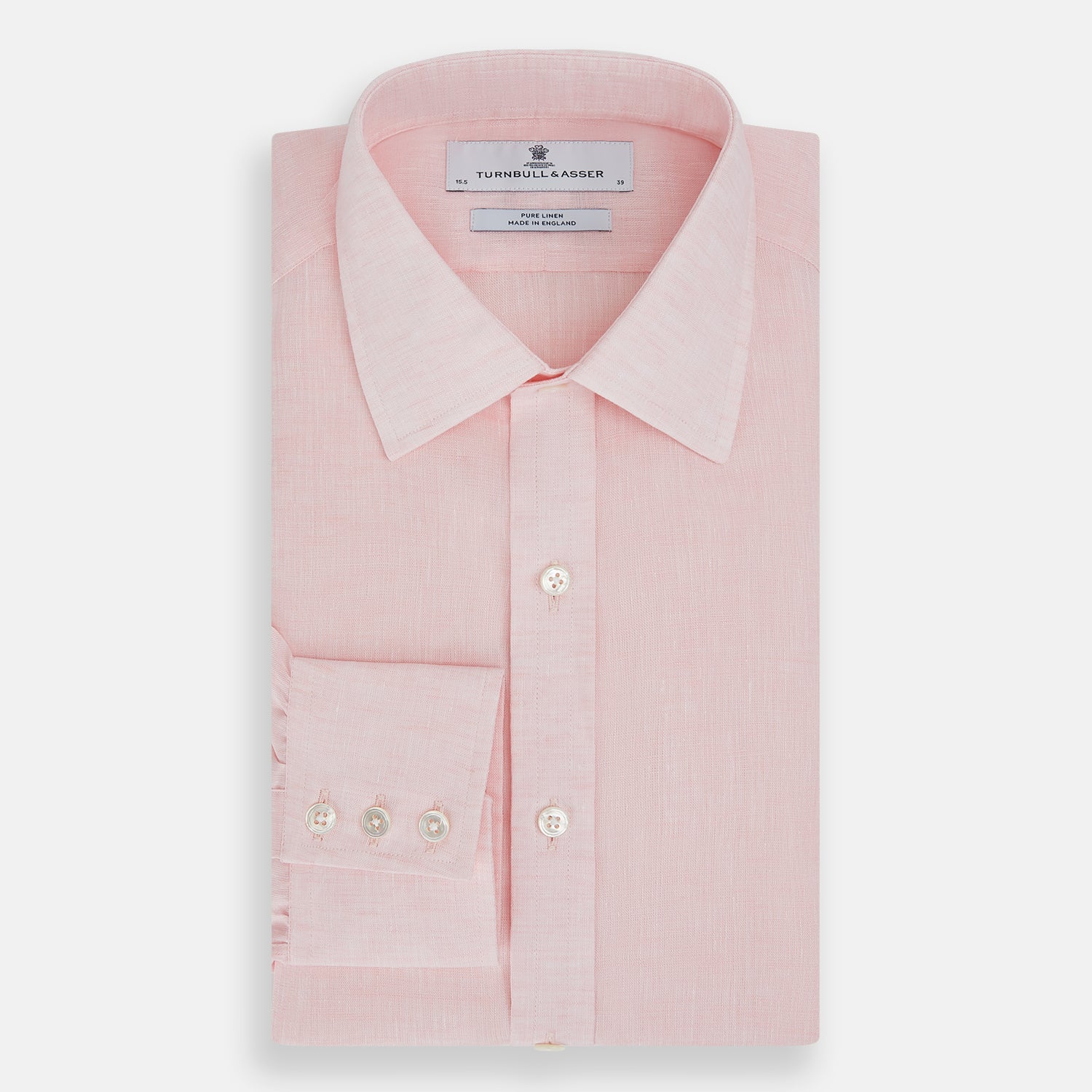 View 5 of product The Turnbull & Asser Pale Pink Linen Mayfair Shirt features a classic, formal style with long sleeves, a collar, and white buttons. Shown laid flat on a white background.