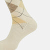 View 4 of product A single Turnbull & Asser White Wool Check Mid-Length Sock, featuring a subtle check pattern in tan, cream, and light brown shades, is displayed on a plain white background.