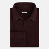 View 5 of product The Turnbull & Asser Burgundy Rugby Polo Shirt is a long-sleeve, pure cotton collared top with no visible buttons, shown laid flat on a white background.