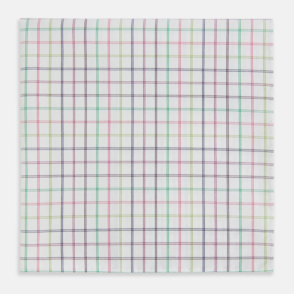 The Turnbull & Asser Green Multi Double Grid Check Hand-Rolled Handkerchief features a white base with thin blue, pink, and green lines forming small squares, finished with elegant hand-rolled edges.